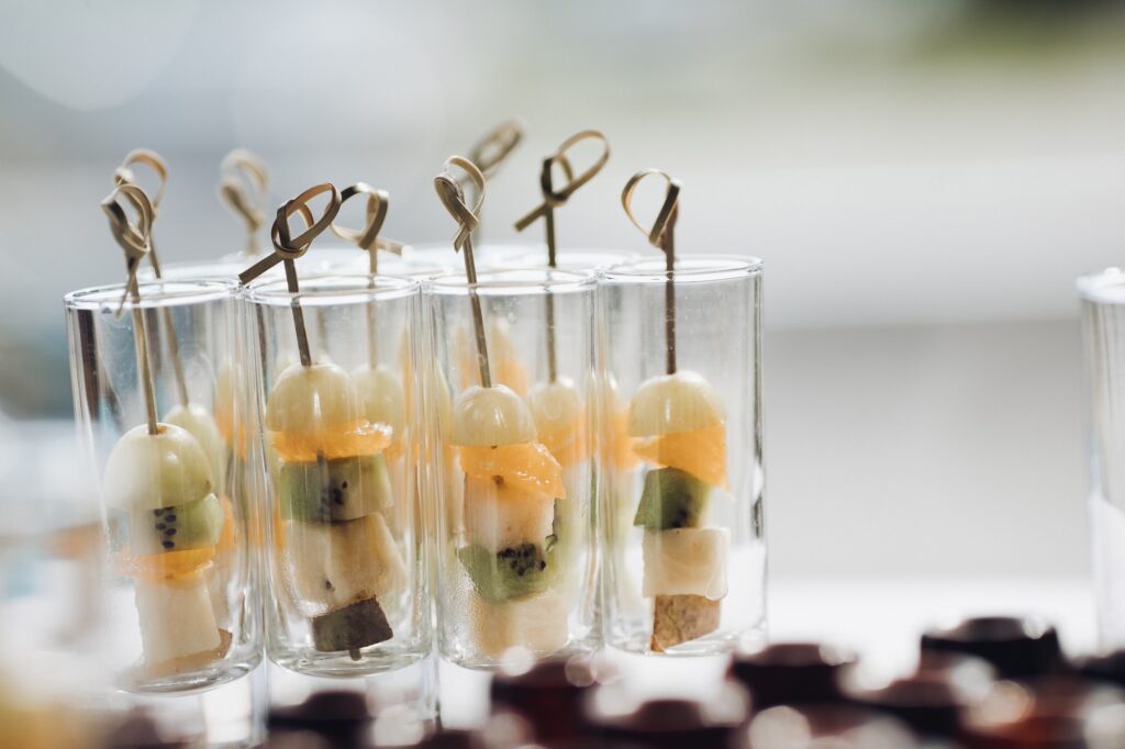 Delicious healthy fruit appetizers on celebration Concept of catering, desserts, arrangement and